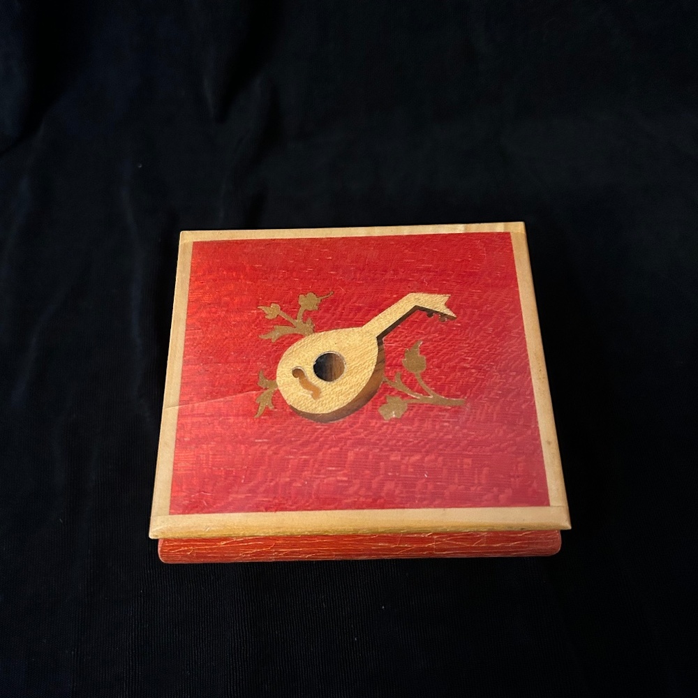 Reuge red vintage music box. Plays Lara'sTheme from Dr. Zhivago.